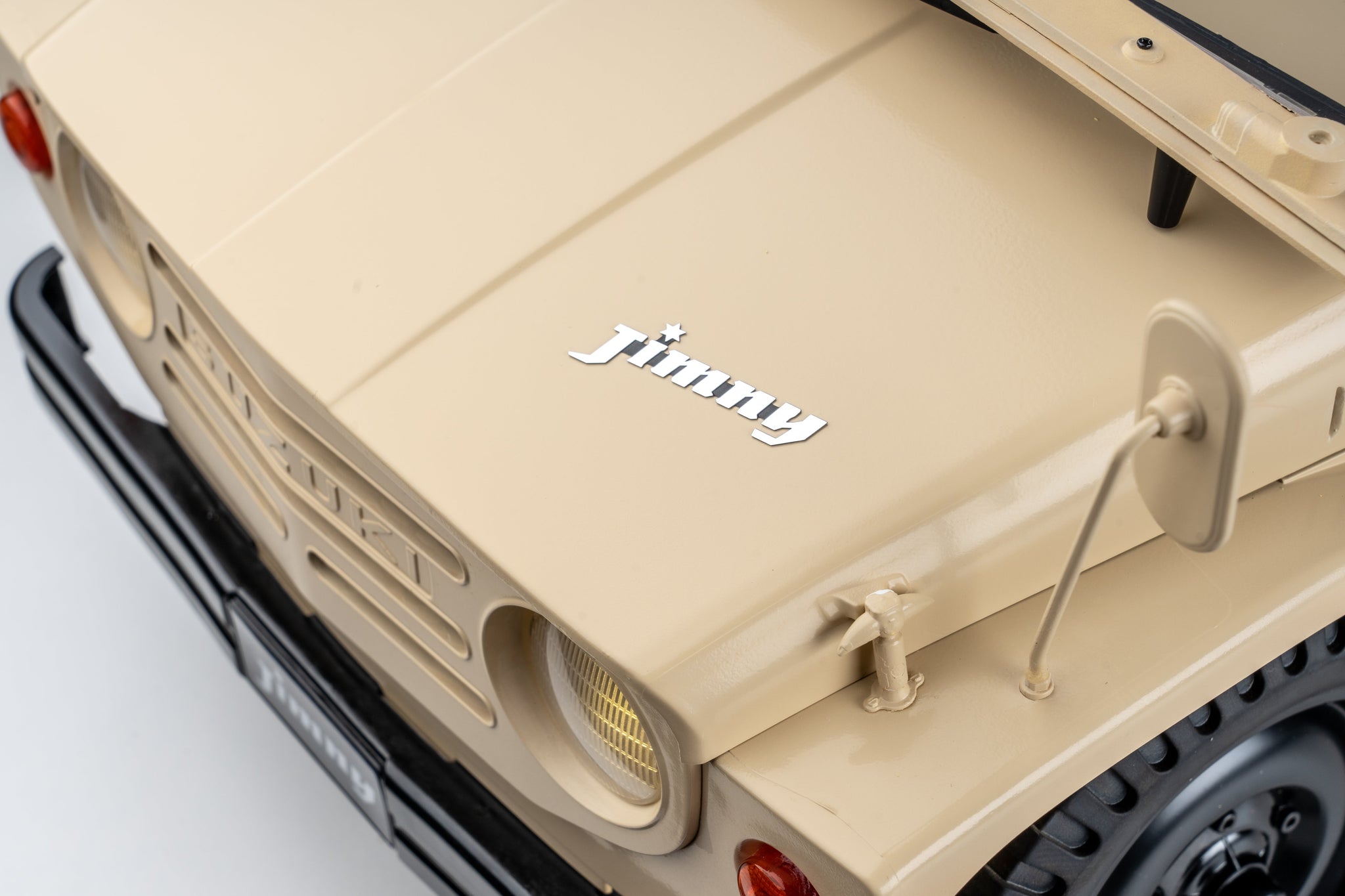 FMS 1:6 scale RC Jimny RS in brown, showing the front hood with the chrome 