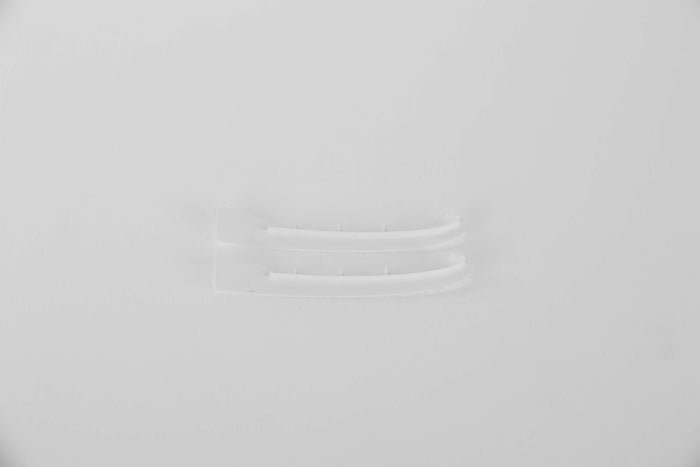 Clear plastic connectors for RC model assembly on a white background