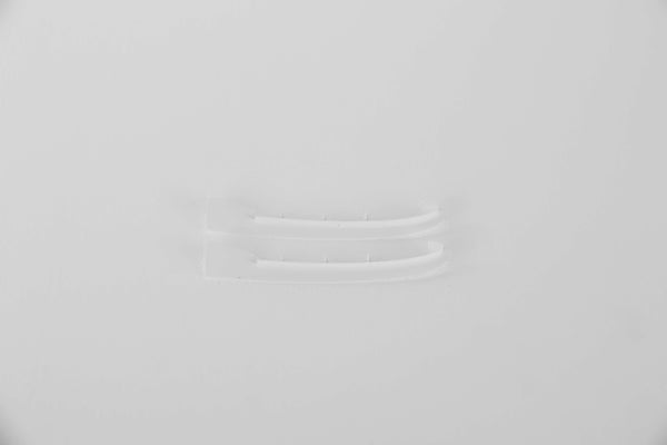 Clear plastic connectors for RC model assembly on a white background