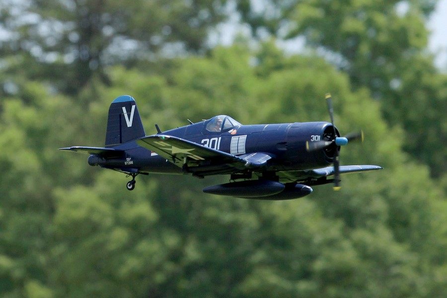 FMS 1400mm blue F4U Corsair RC airplane in flight with numbered markings 201 and 301.