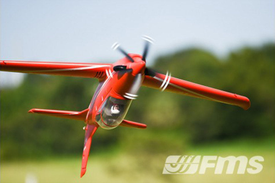 FMS 1100mm PC-21 Pilatus PNP red RC airplane in flight with blurred propeller and FMS logo